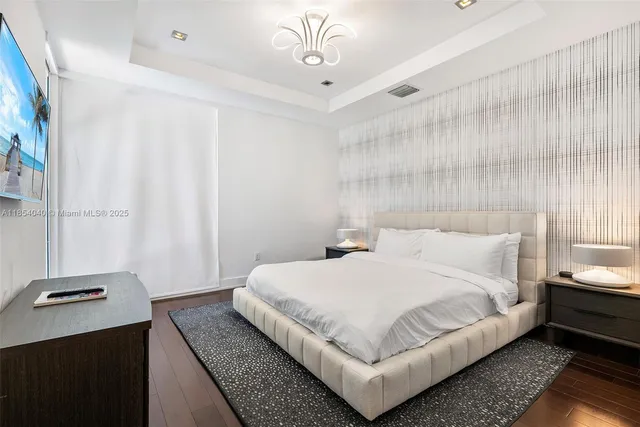 an aerial view of a house with a lake view