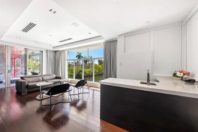 an aerial view of residential houses with outdoor space and river