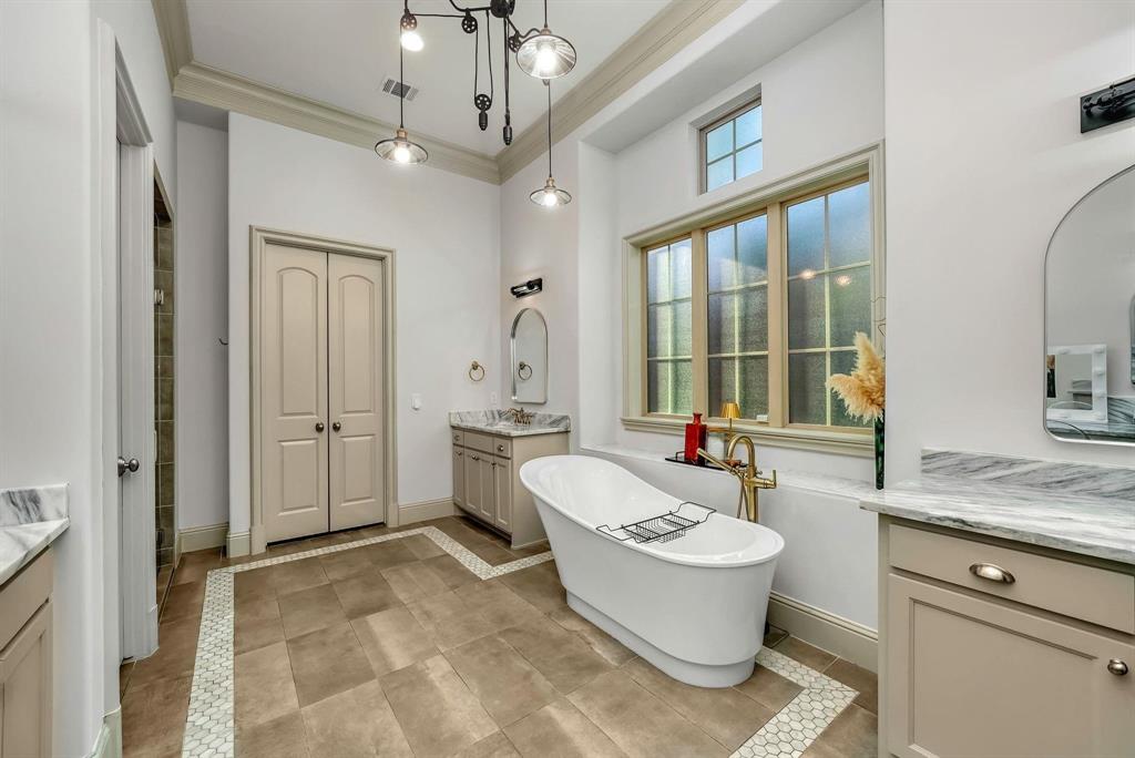 12114 Prestonridge Road Dallas, TX 75230 - Photo 27 of 40 Freestanding soaking tub featuring a brass-finish floor-mounted faucet