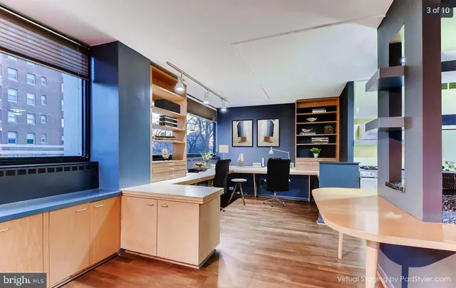 a open kitchen with stainless steel appliances granite countertop a stove and a refrigerator