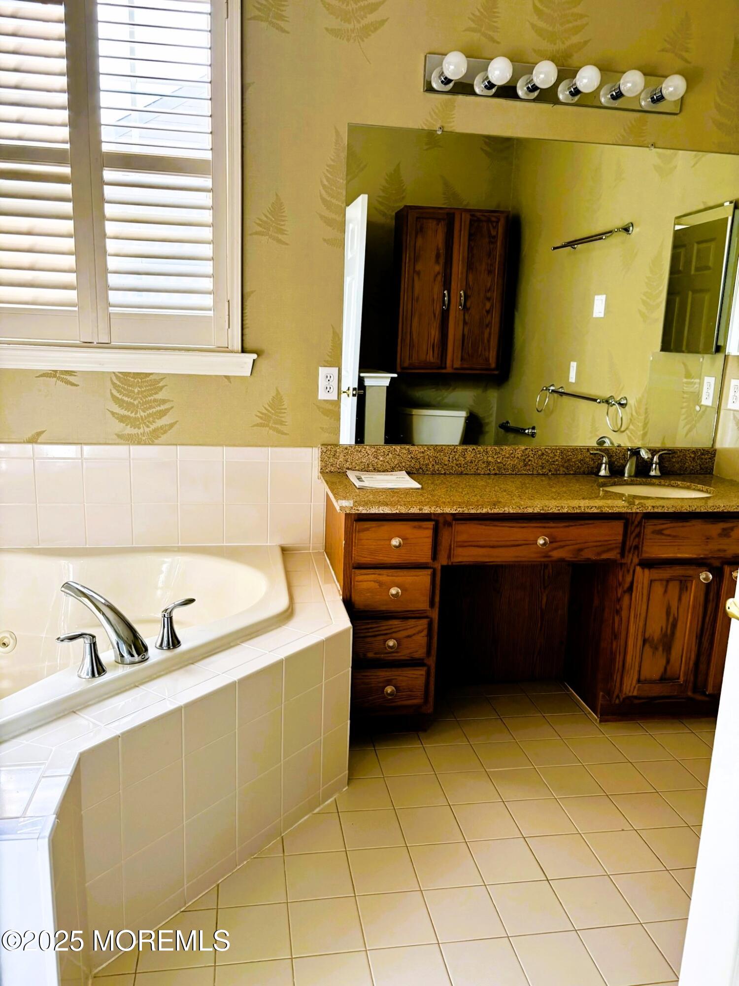 1 Springdale Road Whiting, NJ 08759 - Photo 24 of 47 a bathroom with a tub sink and mirror