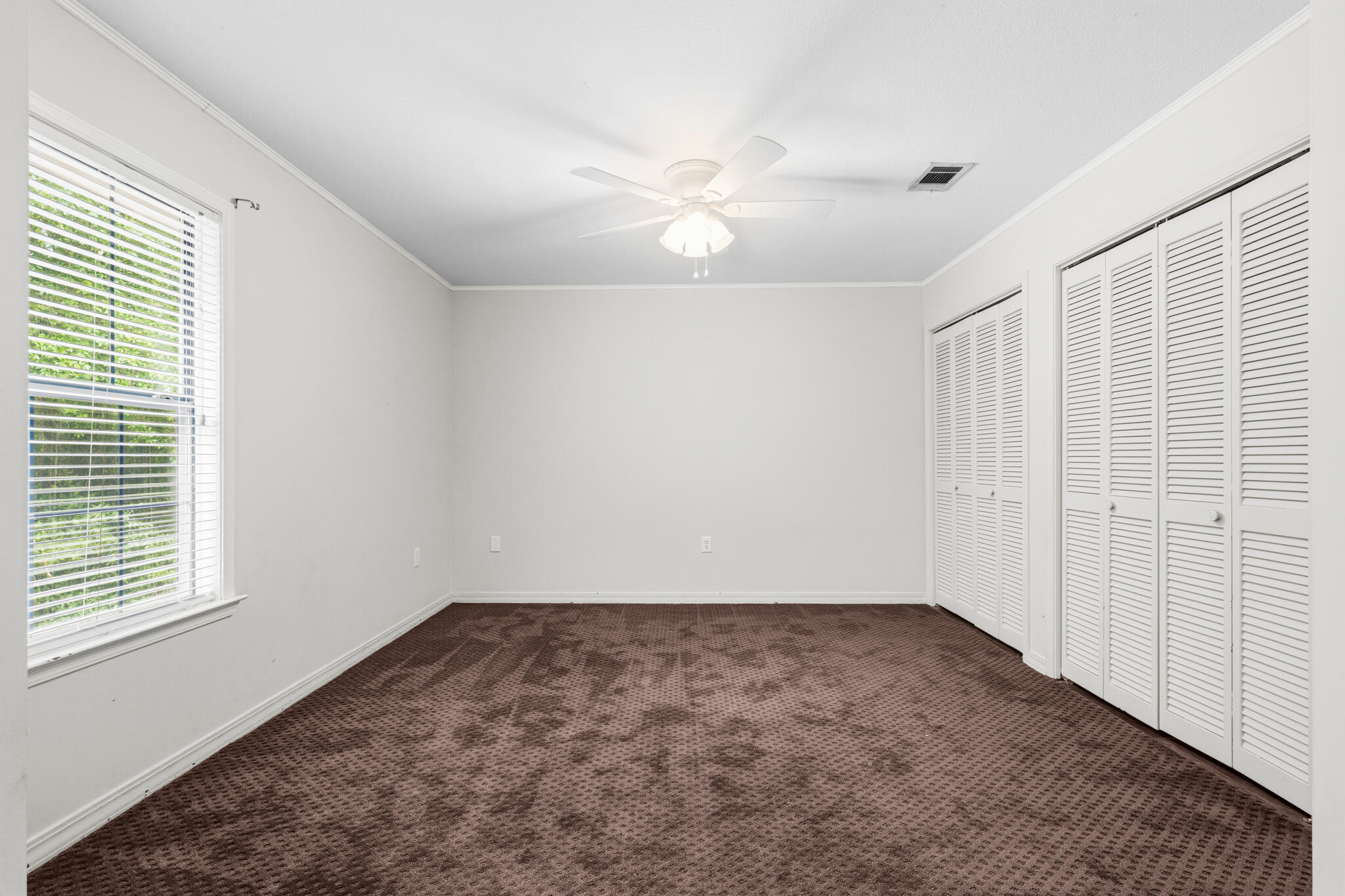 207 Pinoak Court Crestview, FL 32539 - Photo 14 of 33 wooden floor in an empty room with a window