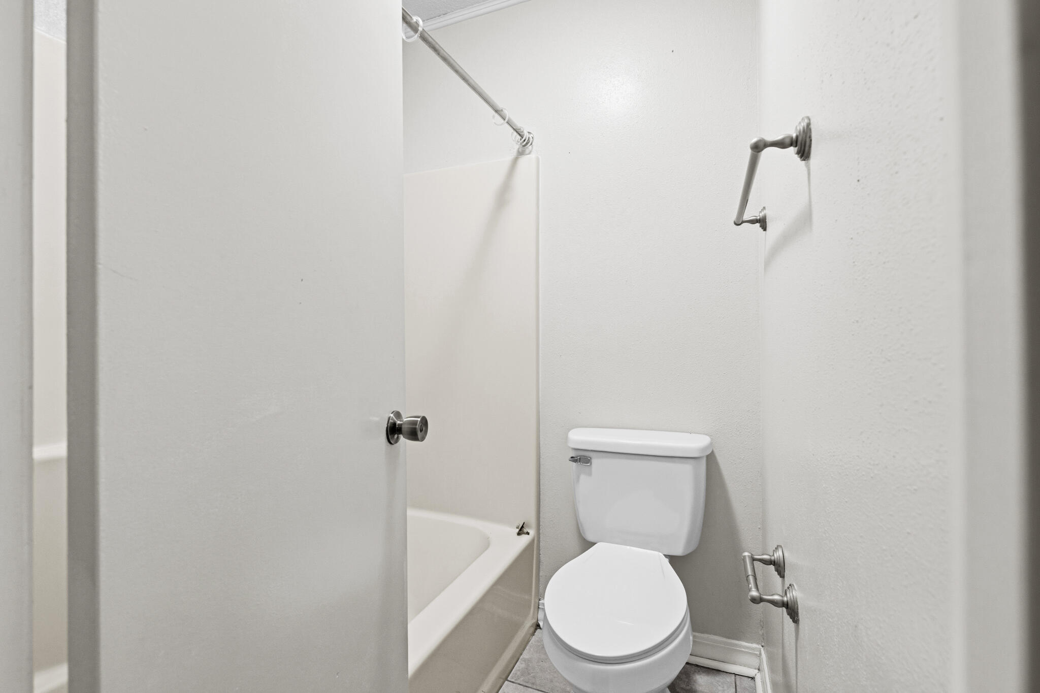 207 Pinoak Court Crestview, FL 32539 - Photo 16 of 33 a white toilet sitting next to a shower
