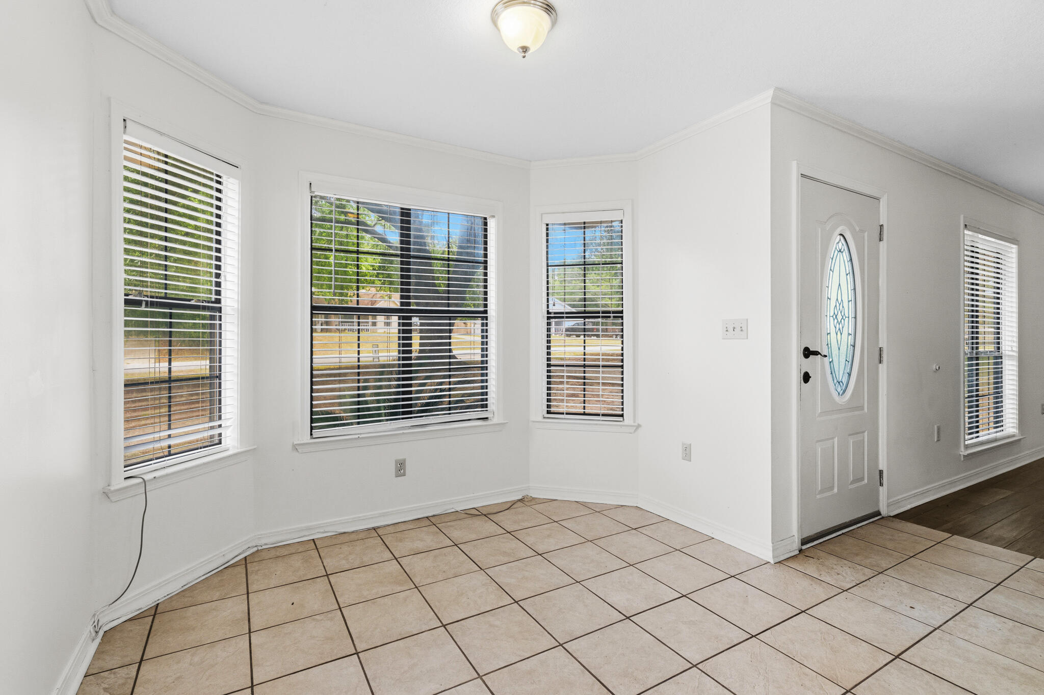 207 Pinoak Court Crestview, FL 32539 - Photo 6 of 33 a view of an empty room and window