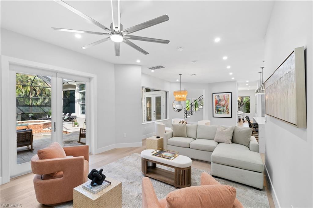 7834 Classics Drive Naples, FL 34113 - Photo 21 of 50 a living room with furniture and a large window