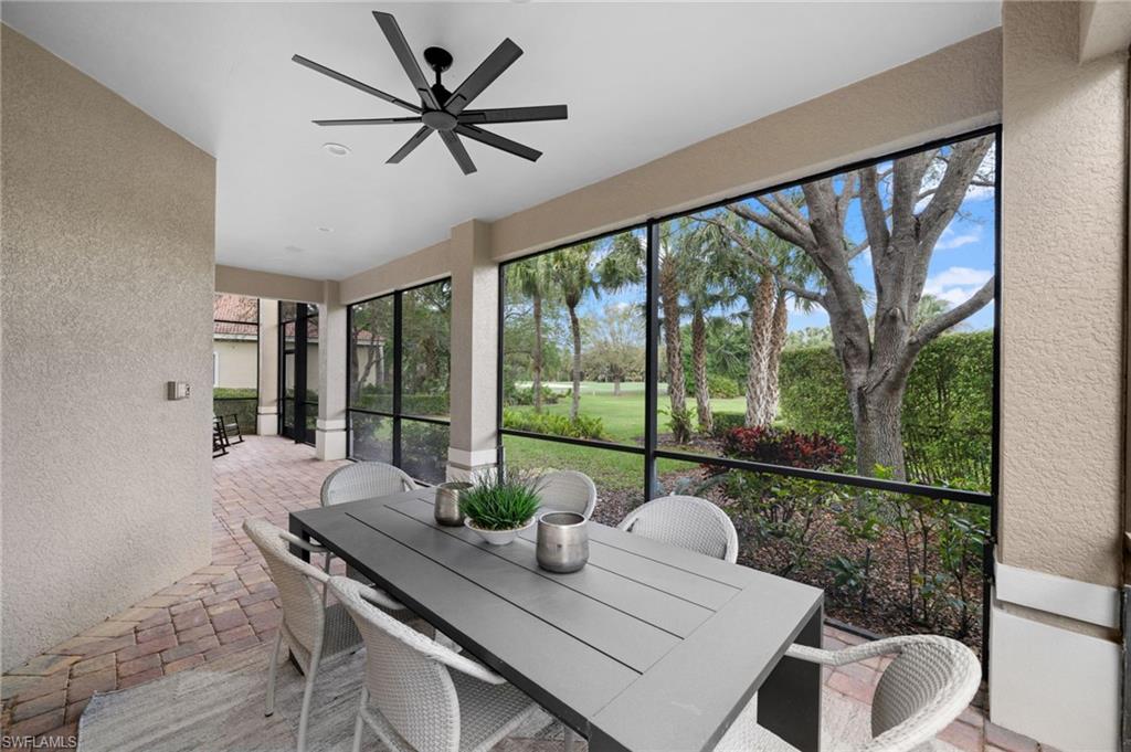 7834 Classics Drive Naples, FL 34113 - Photo 32 of 50 a view of a dining room with furniture window and outside view