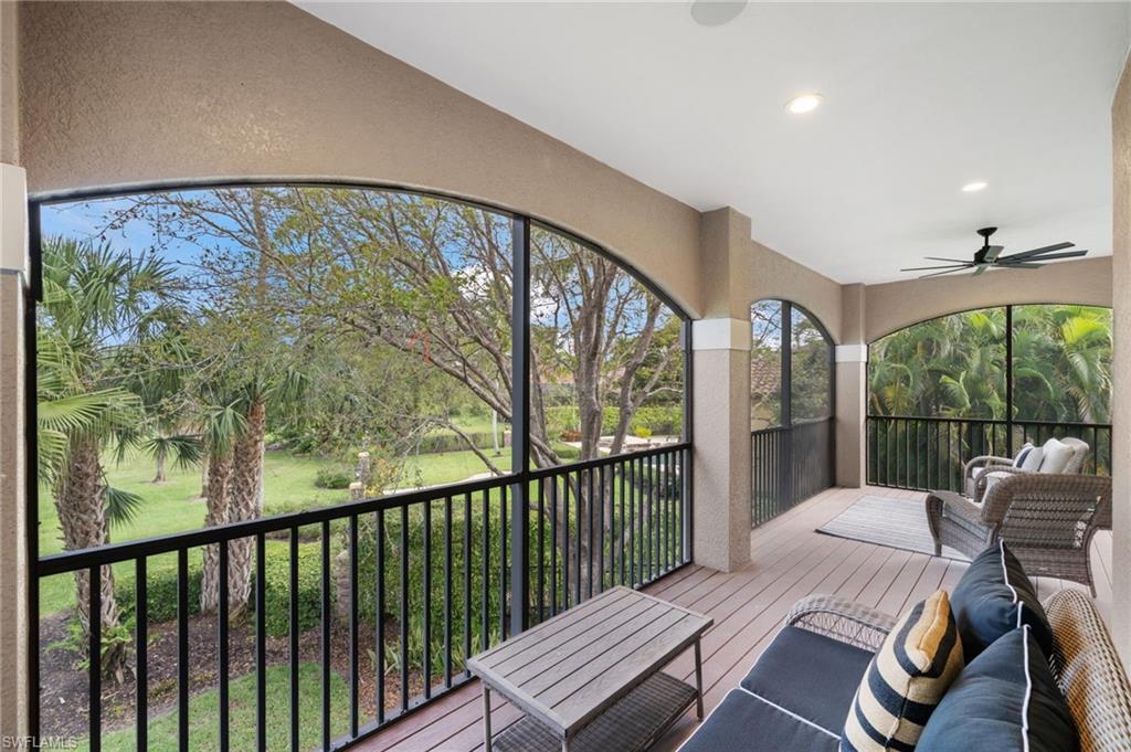 7834 Classics Drive Naples, FL 34113 - Photo 39 of 50 a balcony with furniture and a large window