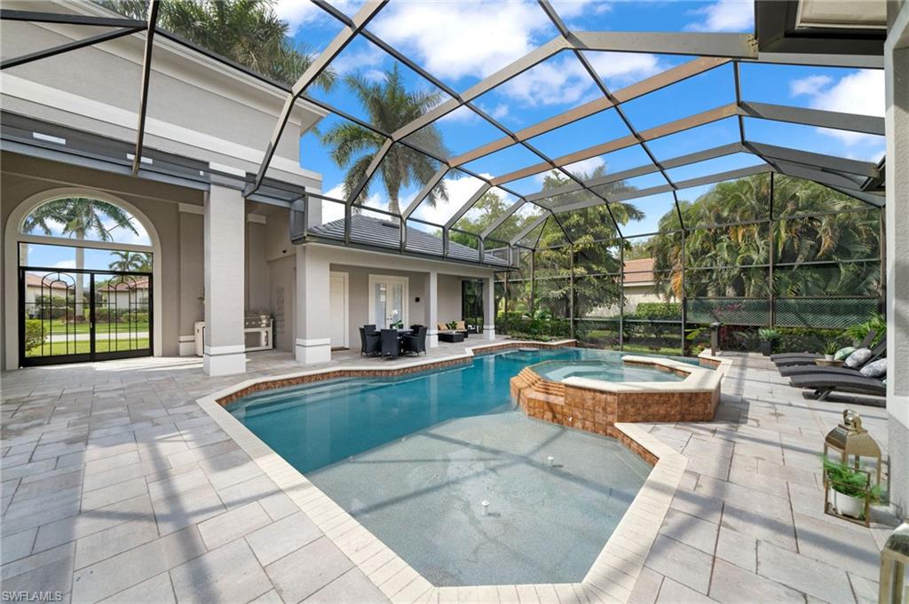 7834 Classics Drive Naples, FL 34113 - Photo 4 of 50 a view of swimming pool with outdoor seating