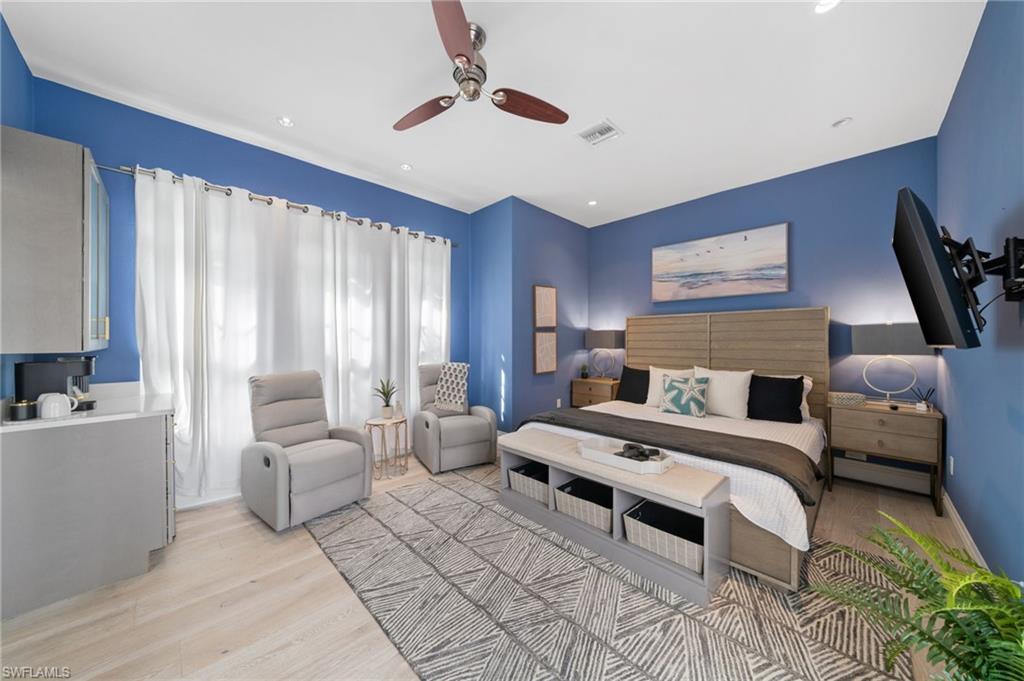 7834 Classics Drive Naples, FL 34113 - Photo 42 of 50 a bedroom with furniture and a large window