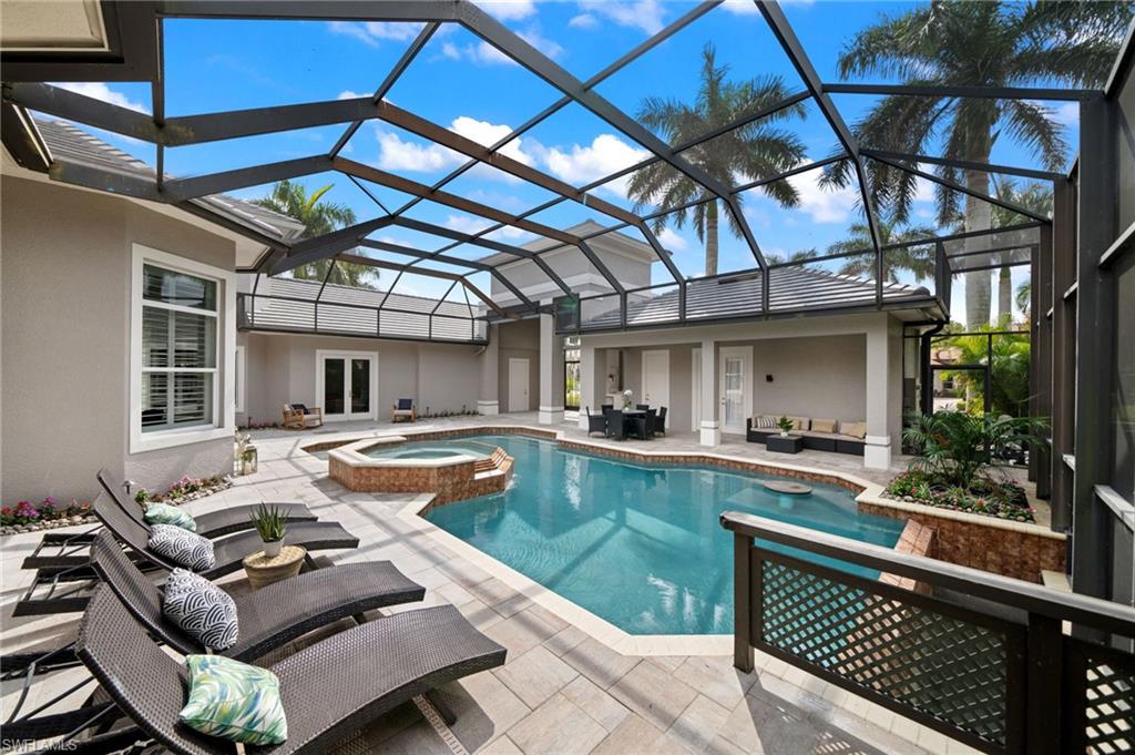 7834 Classics Drive Naples, FL 34113 - Photo 45 of 50 a view of swimming pool with outdoor seating