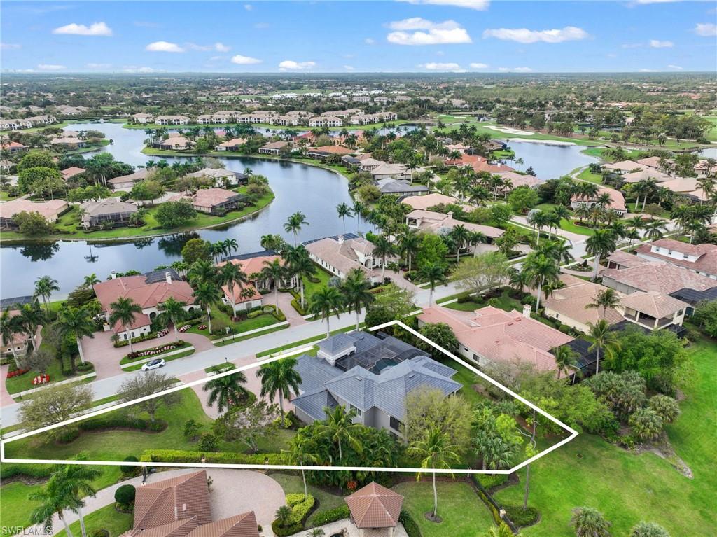 7834 Classics Drive Naples, FL 34113 - Photo 49 of 50 an aerial view of residential houses with outdoor space