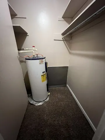 a view of storage and utility room with washer and dryer
