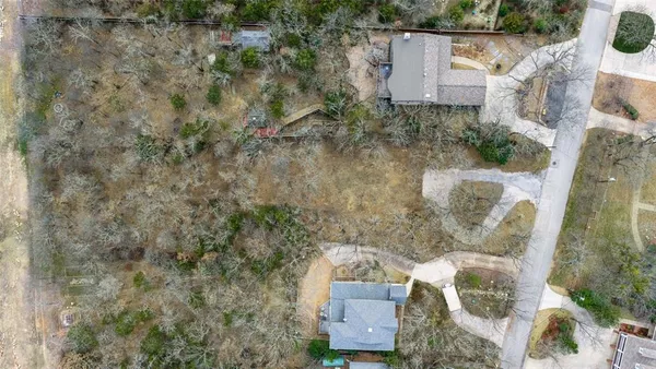a backyard of a house with large trees