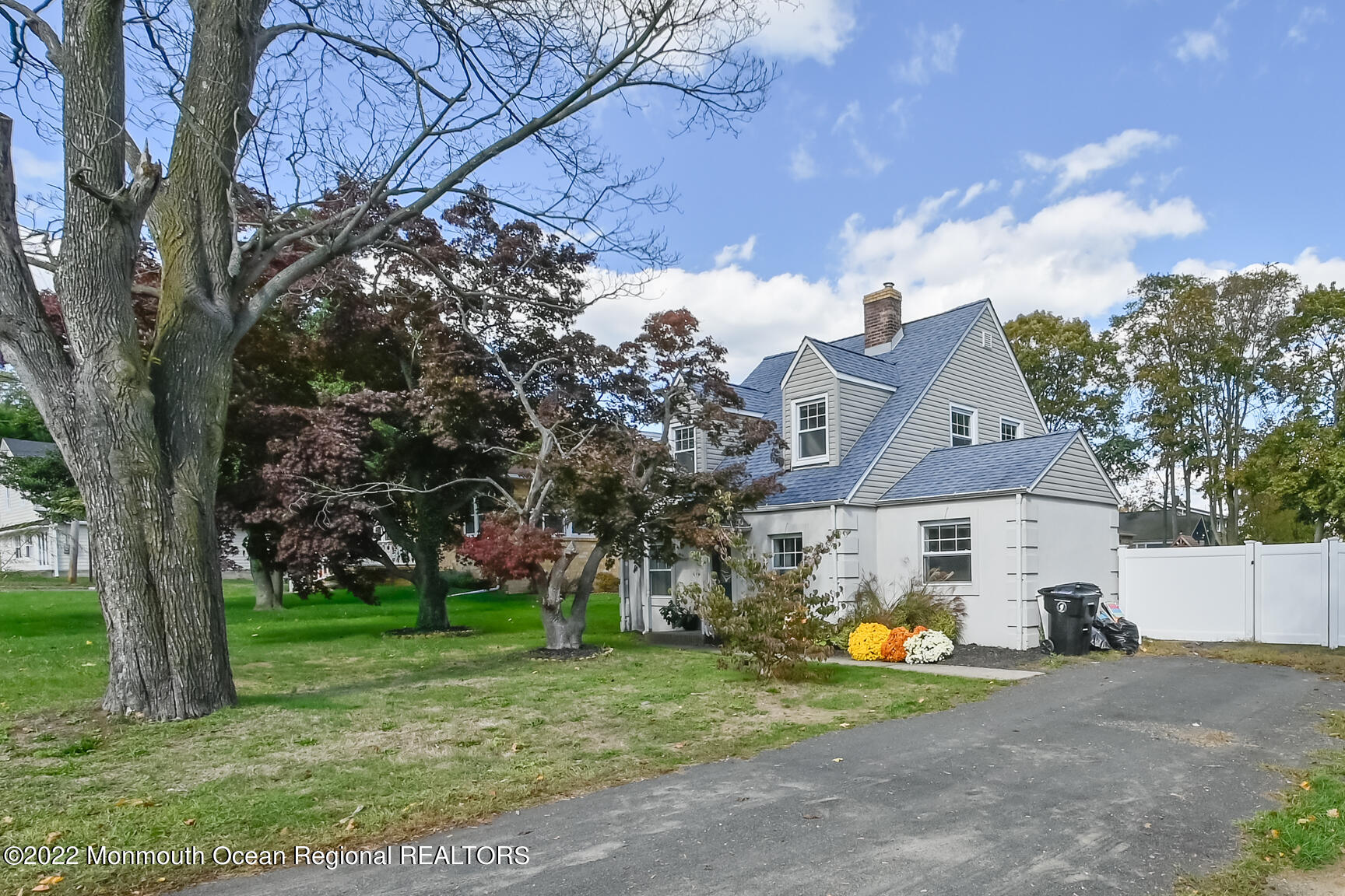 965 Leonardville Road Atlantic Highlands, NJ 07716 - Photo 2 of 29 a view of a house with a yard and large trees