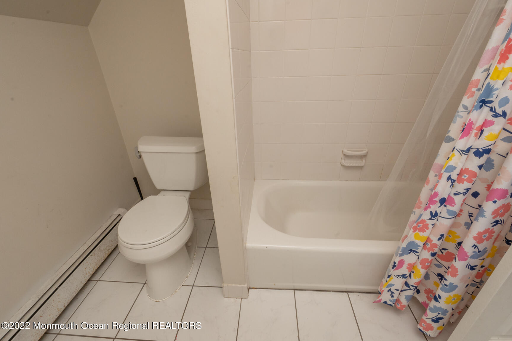 965 Leonardville Road Atlantic Highlands, NJ 07716 - Photo 23 of 29 a bathroom with a toilet and a shower curtain