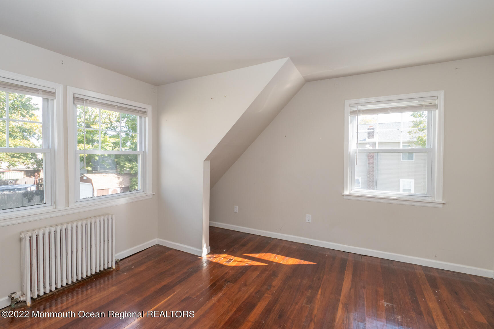965 Leonardville Road Atlantic Highlands, NJ 07716 - Photo 24 of 29 a view of an empty room with wooden floor and a window