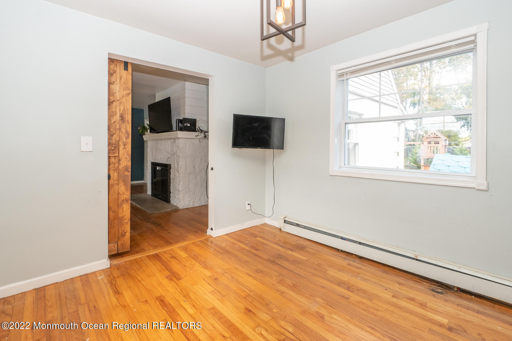 965 Leonardville Road Atlantic Highlands, NJ 07716 - Photo 6 of 29 a bedroom with a bed and a flat screen tv