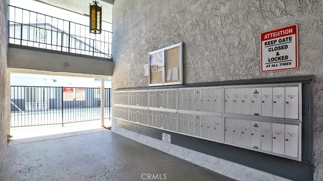 a view of an entryway with wooden fence
