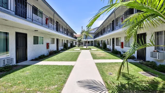 a swimming pool with yard and outdoor seating