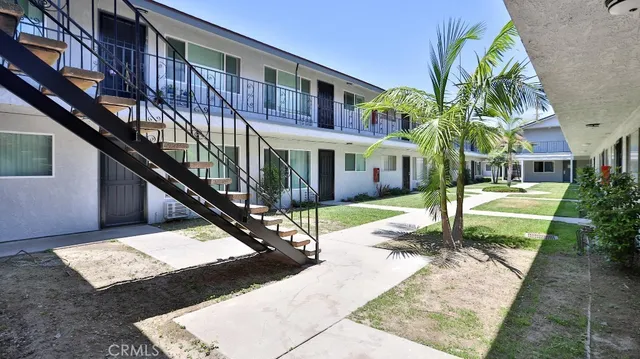 a view of a building with a yard