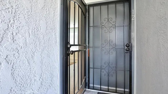 a bathroom with a shower and a door