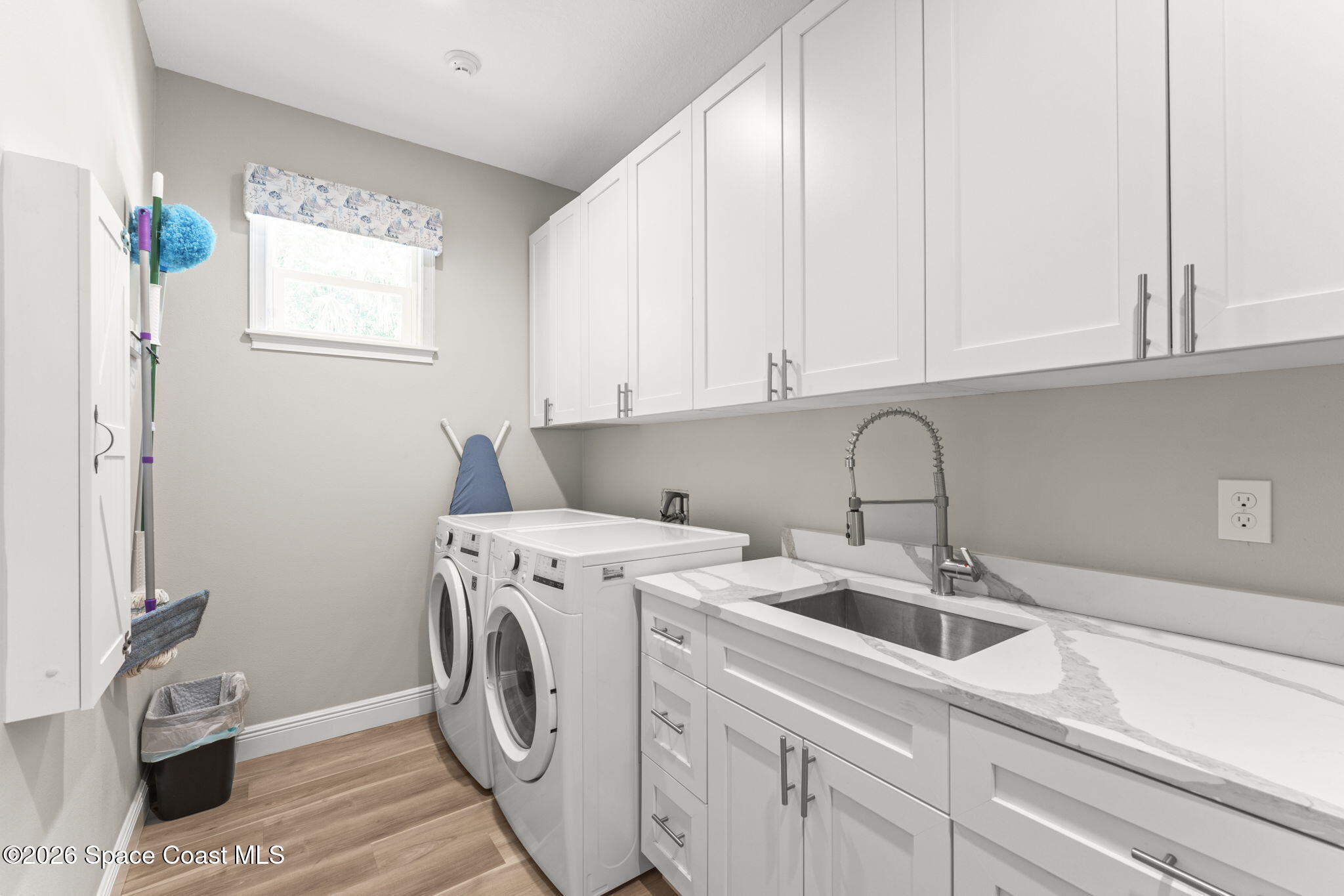 1740 Ford Road Mims, FL 32754 - Photo 33 of 43 a utility room with sink dryer and washer