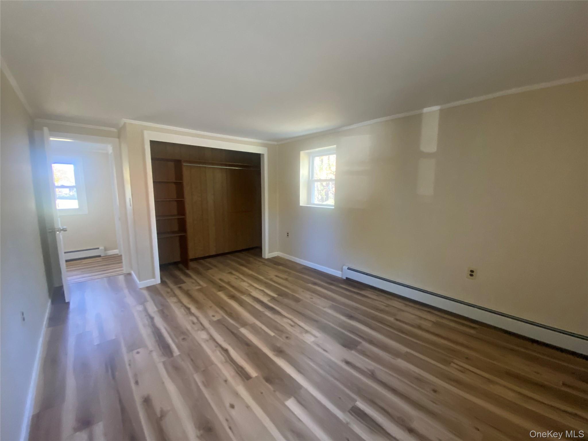 101 Randall Street, Unit A Florida, NY 10921 - Photo 8 of 11 a view of an empty room with wooden floor and a window