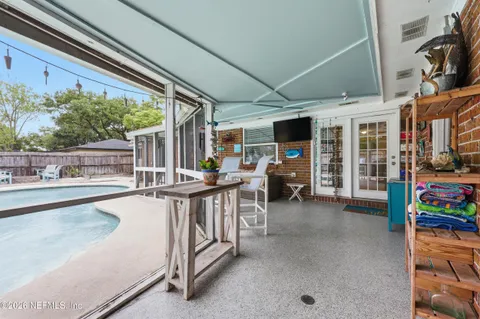 a view of a swimming pool with a patio