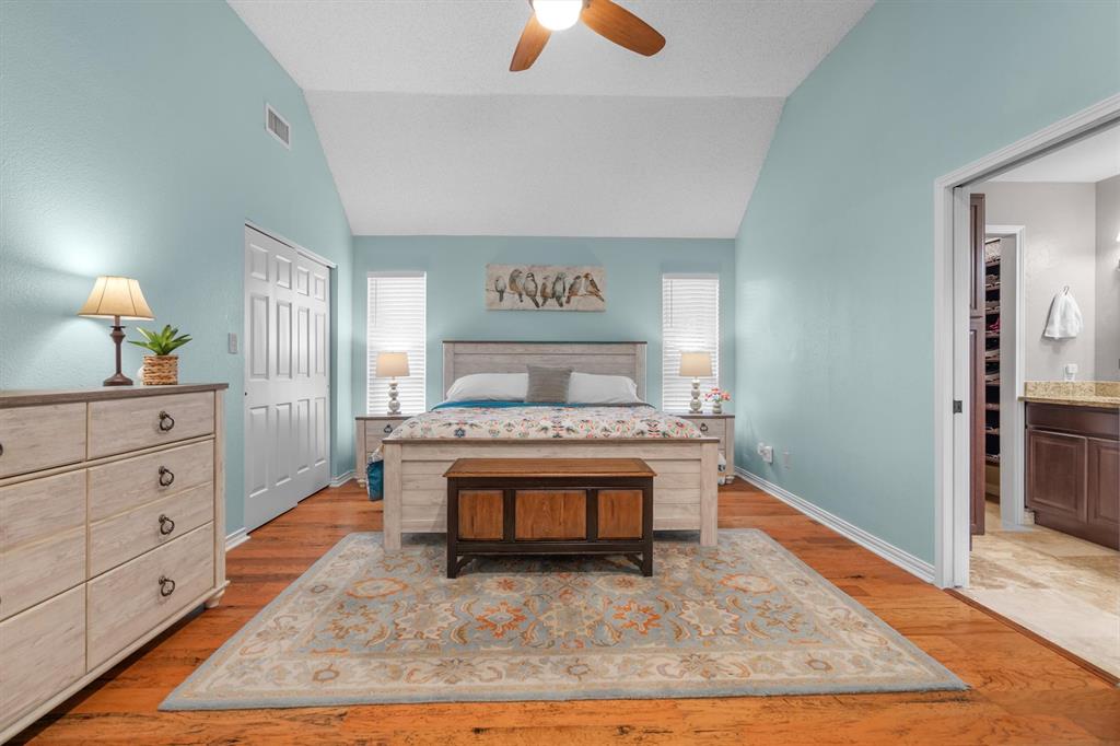 410 Simmons Road Double Oak, TX 75077 - Photo 17 of 40 Serene primary bedroom retreat with soft palette and plenty of space to unwind.