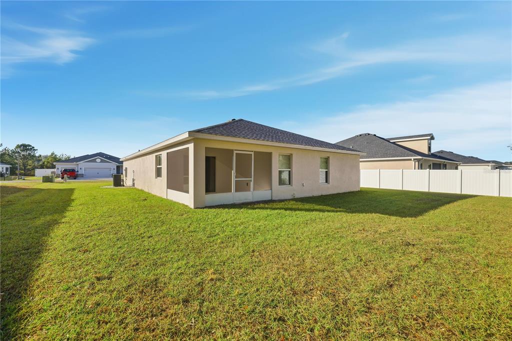 4611 Southeast 89th Street Ocala, FL 34480 - Photo 29 of 33 a view of a house with a yard