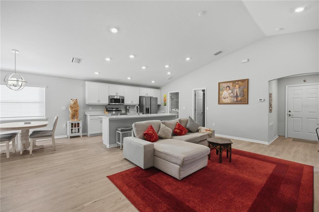 4611 Southeast 89th Street Ocala, FL 34480 - Photo 6 of 33 a living room with furniture and kitchen view