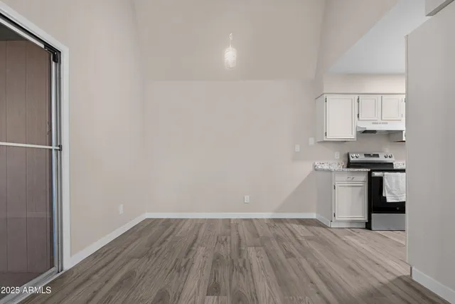 a view of kitchen with wooden floor