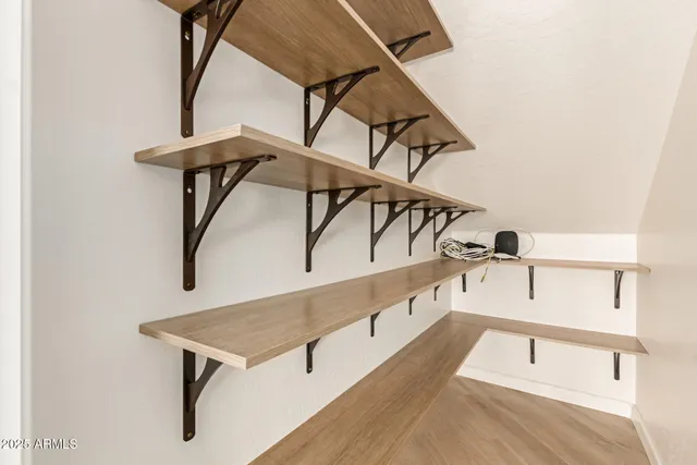 a view of an empty room and a window