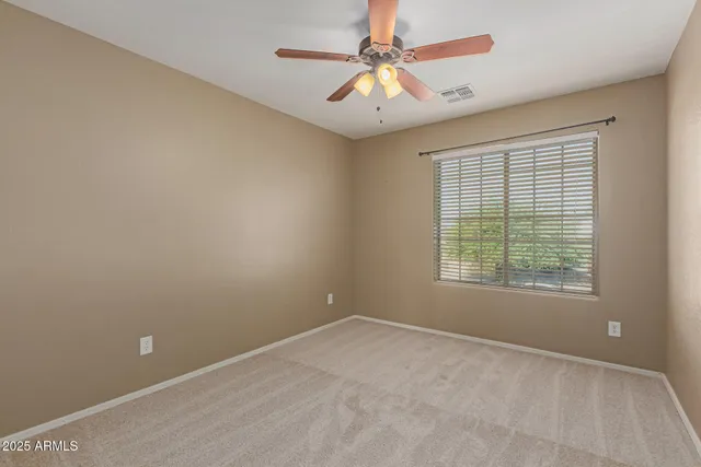 a view of a chandelier fan in a room