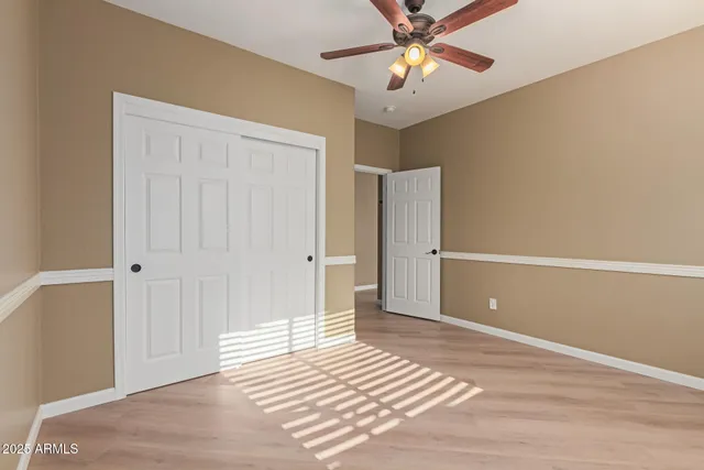 a bathroom with a bathtub shower sink vanity and toilet