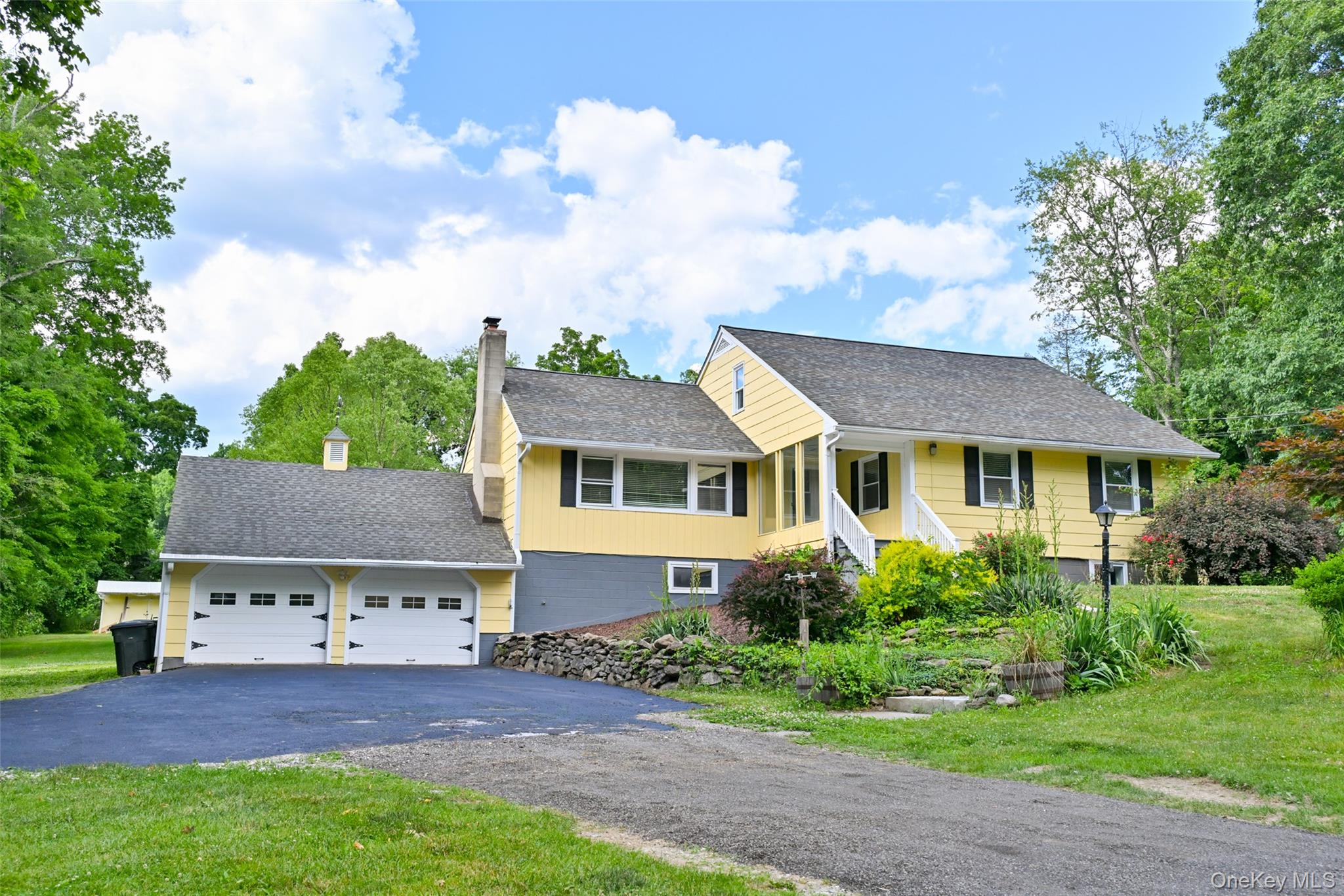 136 Foggintown Road Brewster, NY 10509 - Photo 1 of 50 front view of a house with a yard