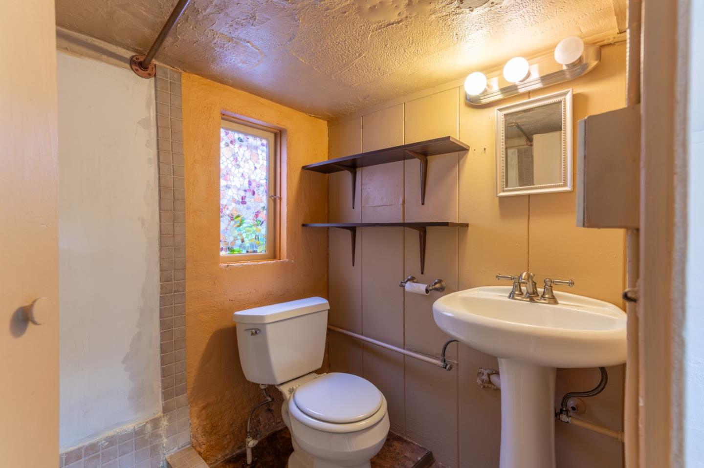 0 Mission 3 Sw 4th Carmel, CA 93921 - Photo 43 of 51 a bathroom with a toilet sink and mirror