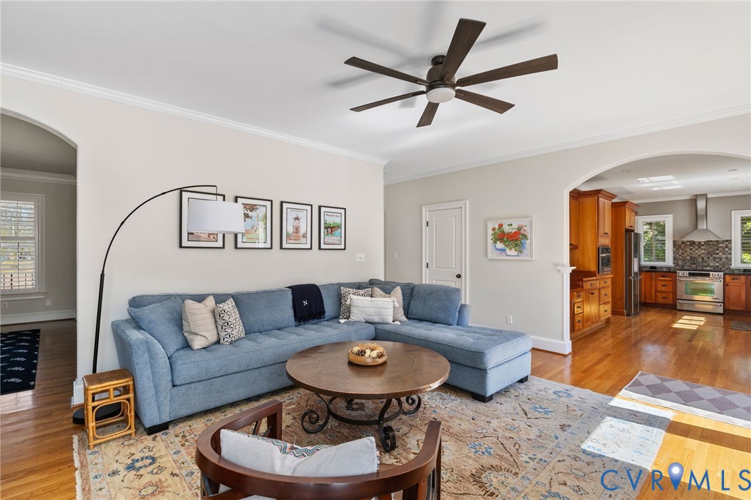 8947 Cherokee Road Richmond, VA 23235 - Photo 22 of 45 a living room with furniture and a wooden floor
