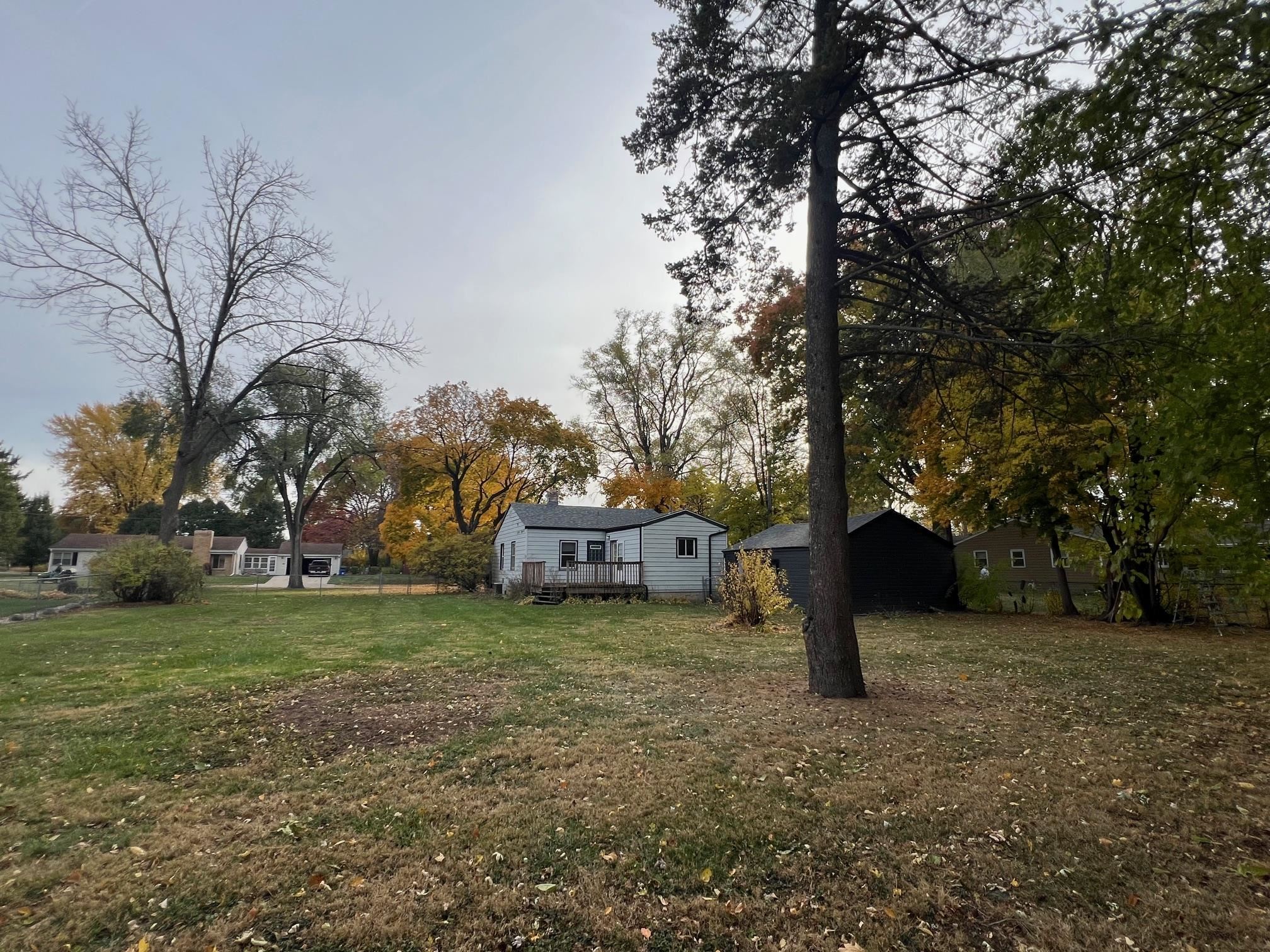 3906 Abbotsford Road Rockford, IL 61107 - Photo 15 of 16 a view of a yard with a house in the background
