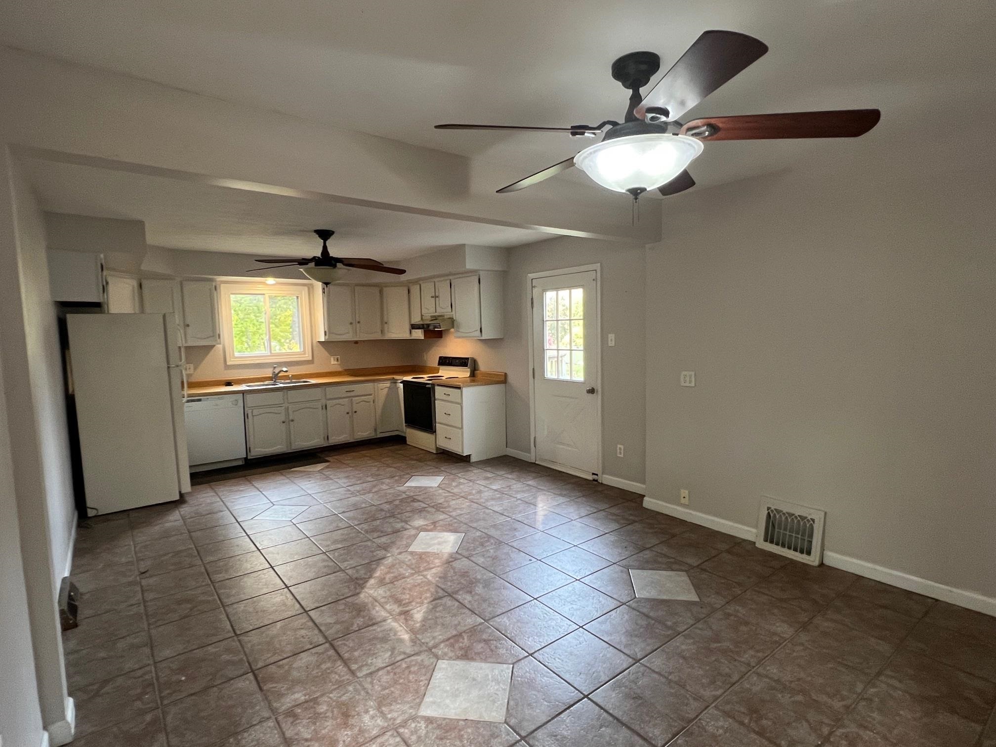 3906 Abbotsford Road Rockford, IL 61107 - Photo 7 of 16 a view of an empty room and window and fire place