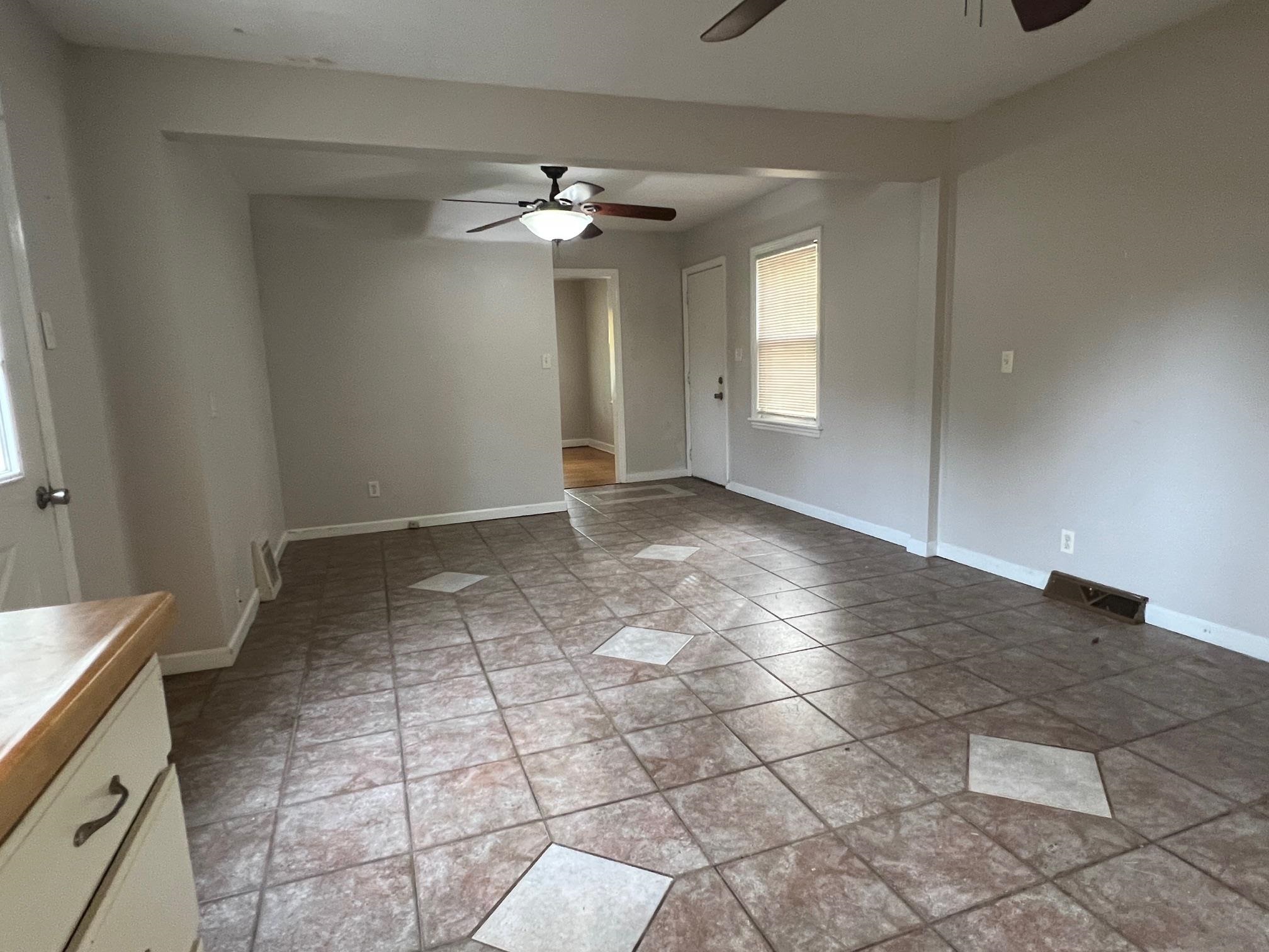 3906 Abbotsford Road Rockford, IL 61107 - Photo 8 of 16 a view of an empty room with window and chandelier fan
