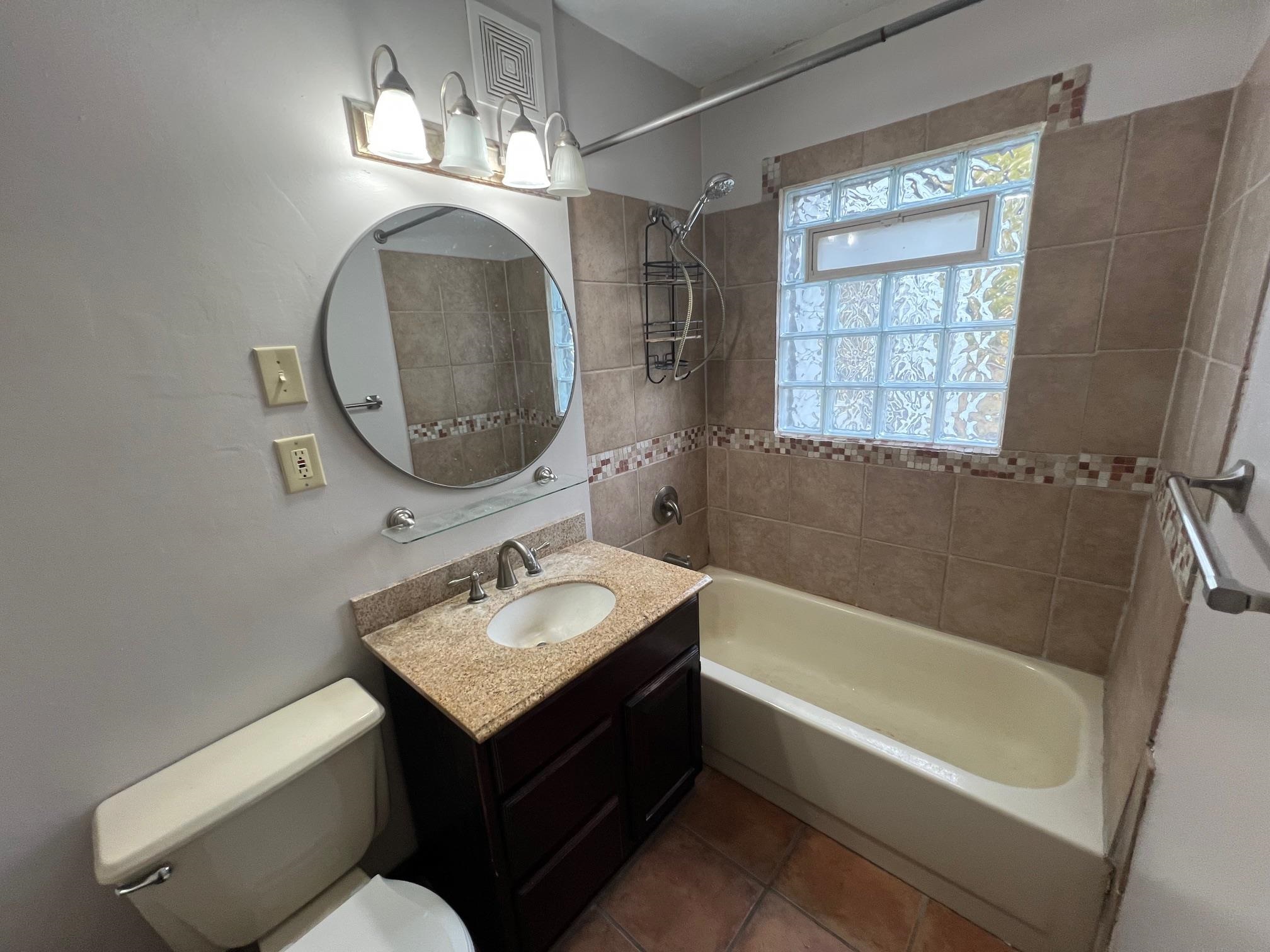 3906 Abbotsford Road Rockford, IL 61107 - Photo 9 of 16 a bathroom with a sink toilet and shower