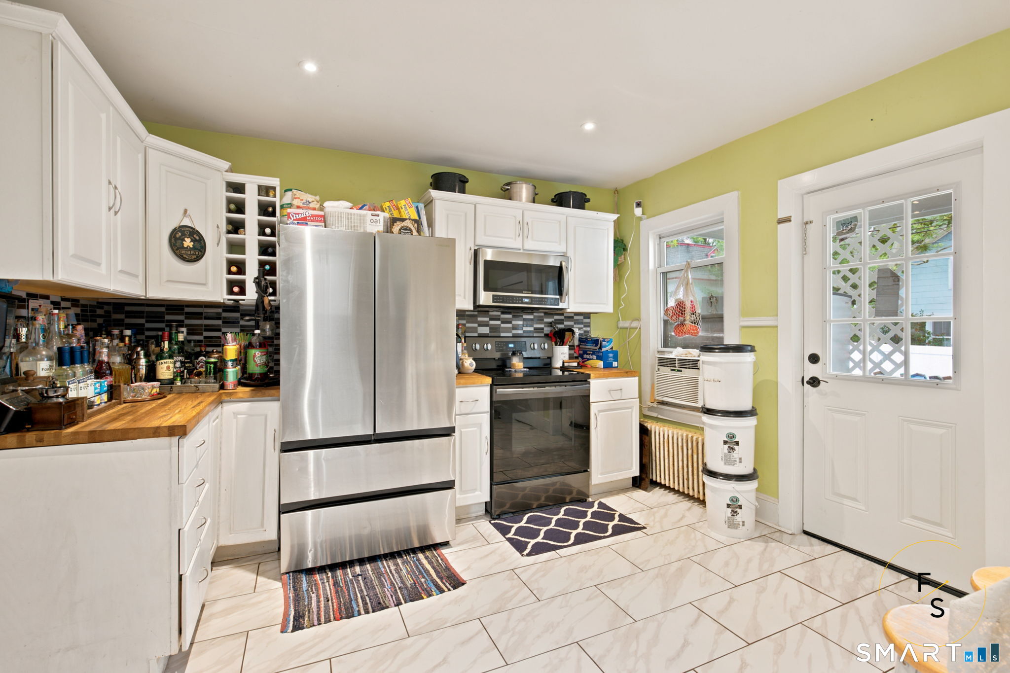182 Broad Street Norwich, CT 06360 - Photo 15 of 30 a kitchen with stainless steel appliances granite countertop a refrigerator and a stove top oven