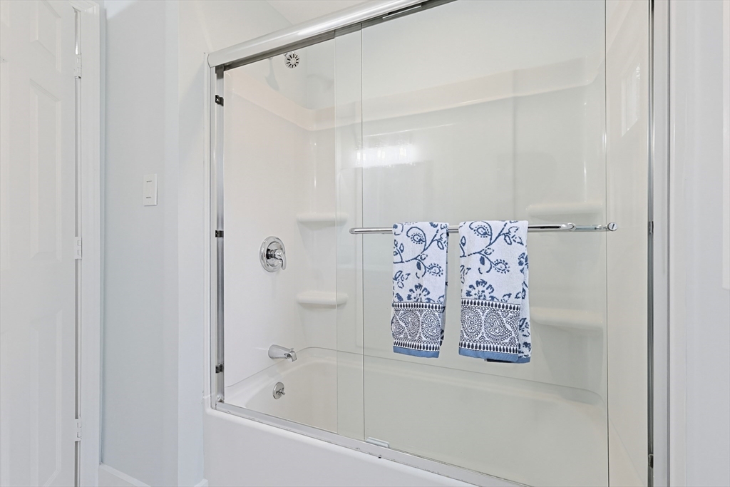 24 Otis Road Barnstable, MA 02601 - Photo 13 of 33 a bathroom with a bathtub and shower