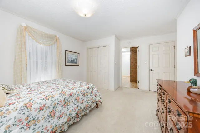 a bedroom with a bed and dresser