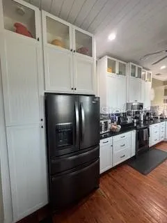 a kitchen with granite countertop stainless steel appliances and cabinets