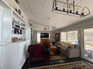 a living room with furniture fireplace and flat screen tv