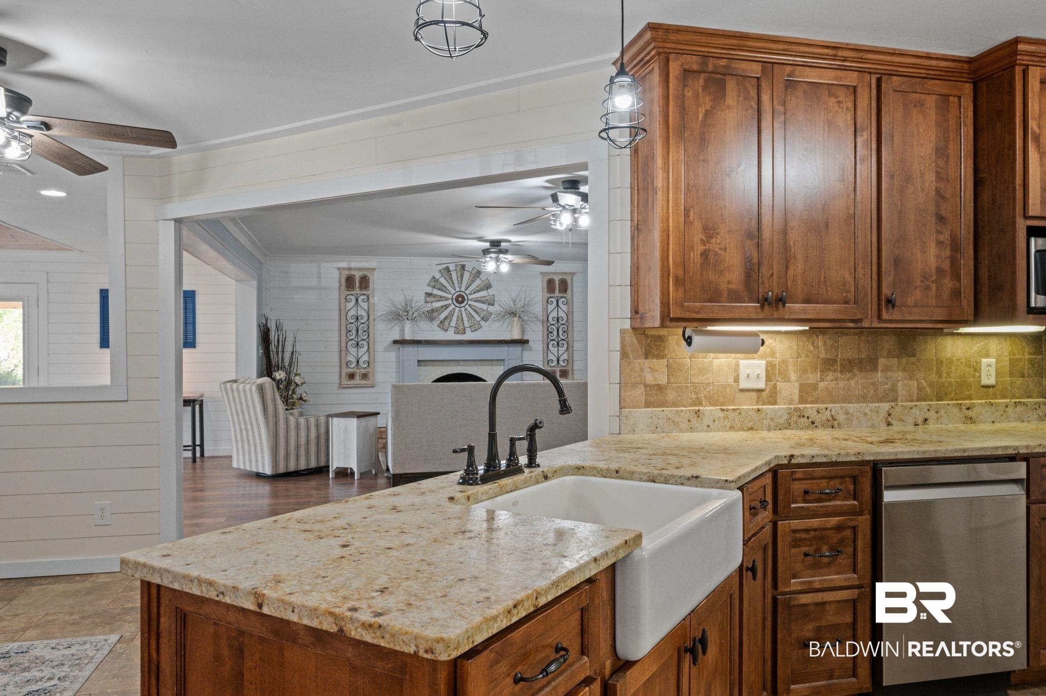 20037 County Road 33 Fairhope, AL 36532 - Photo 15 of 79 Kitchen with light stone countertops, wood-type flooring, sink, pendant lighting, and stainless steel dishwasher