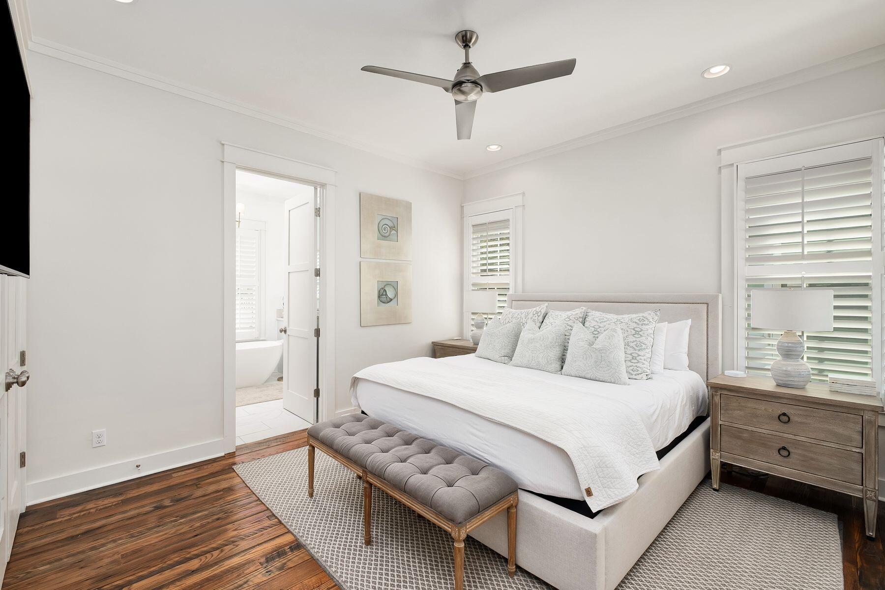 13 Madaket Way Watersound, FL 32461 - Photo 17 of 51 a bedroom with a bed and a chandelier