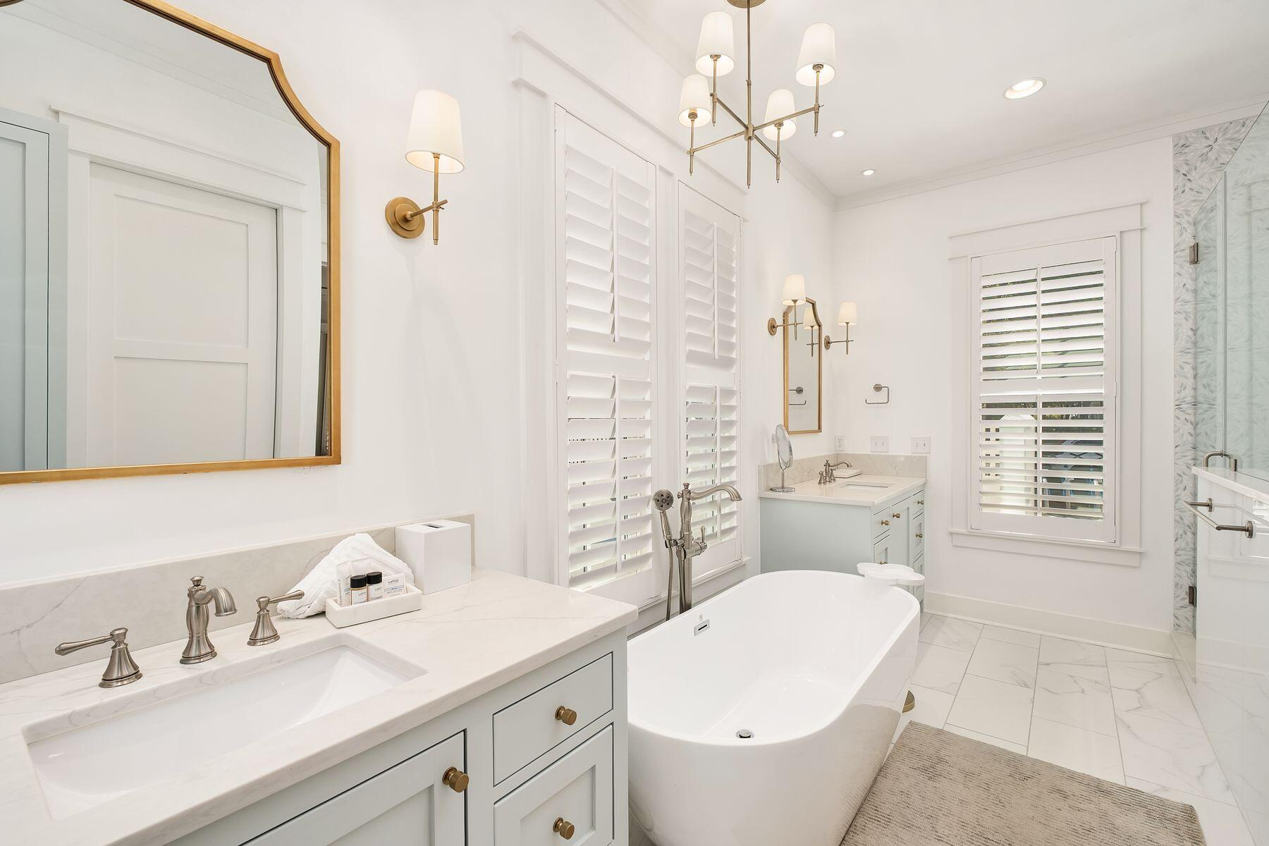 13 Madaket Way Watersound, FL 32461 - Photo 18 of 51 a bathroom with a toilet sink and mirror